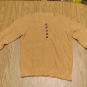 Yellow sweater with buttons.